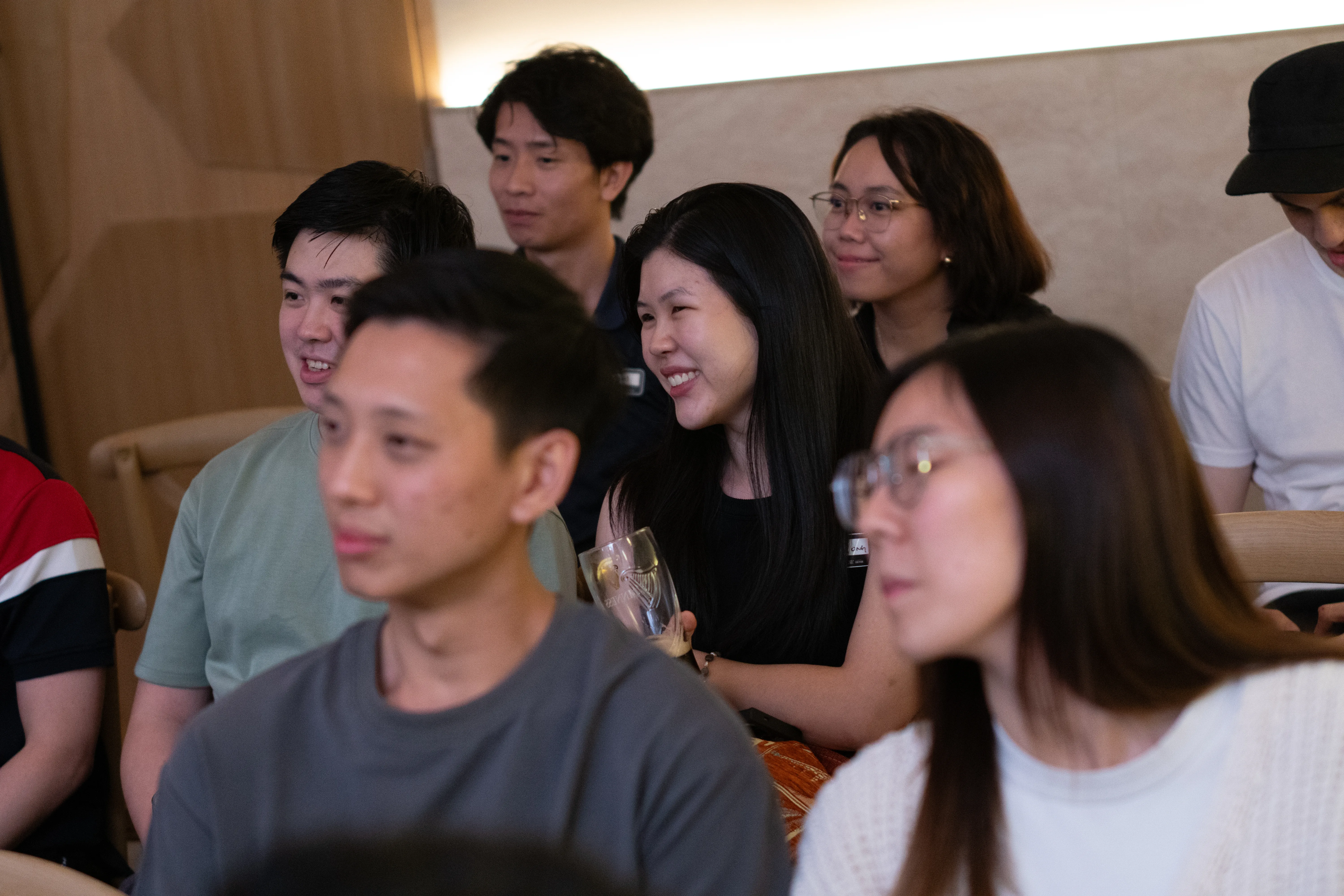 Participants listening and laughing